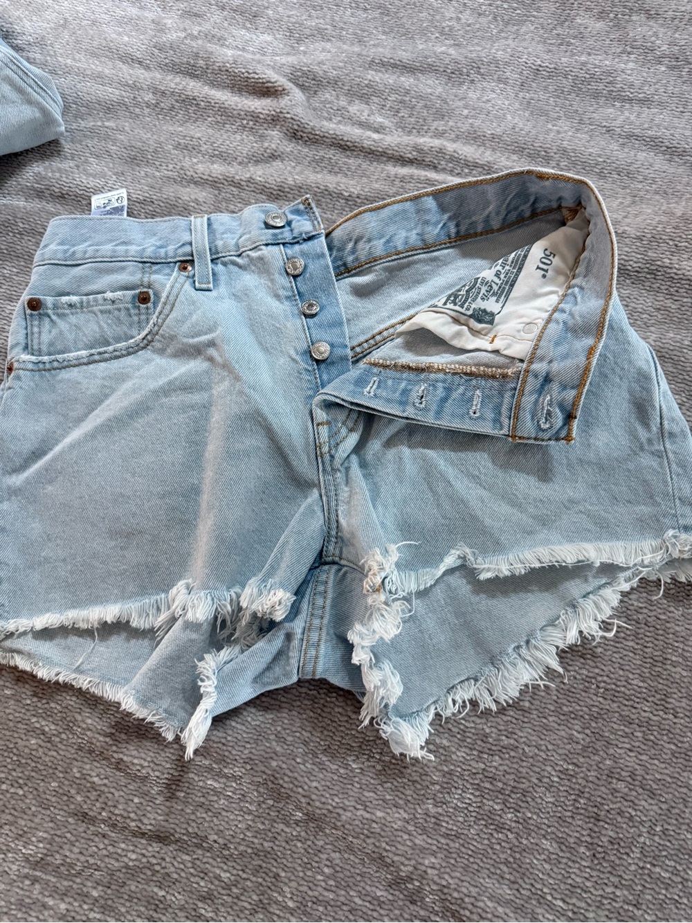 Levi's Light Wash Raw Hem High-Rise Denim Shorts